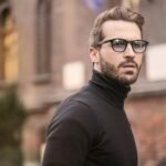 A fashionable man with glasses and a beard captured outdoors in Budapest. of barber shop